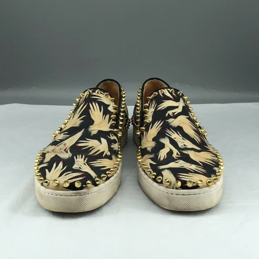 Christian Louboutin Black and Gold Loafers with Slip-On Design